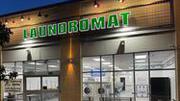 photo of raceway mounted channel letters, white faces with green vinyl